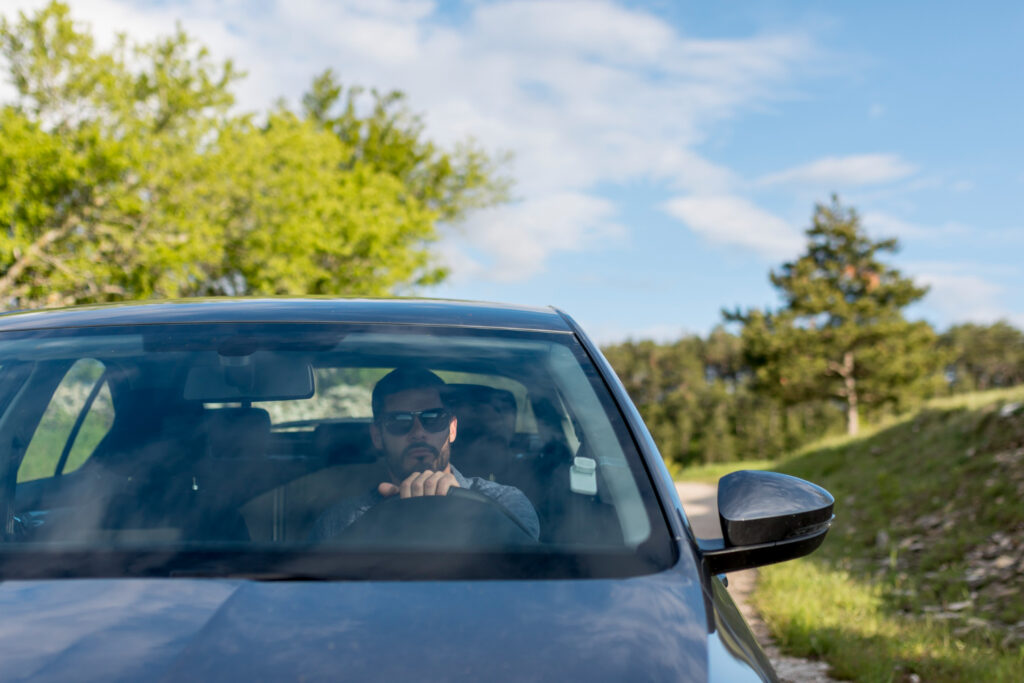 Man driving in black shirt
